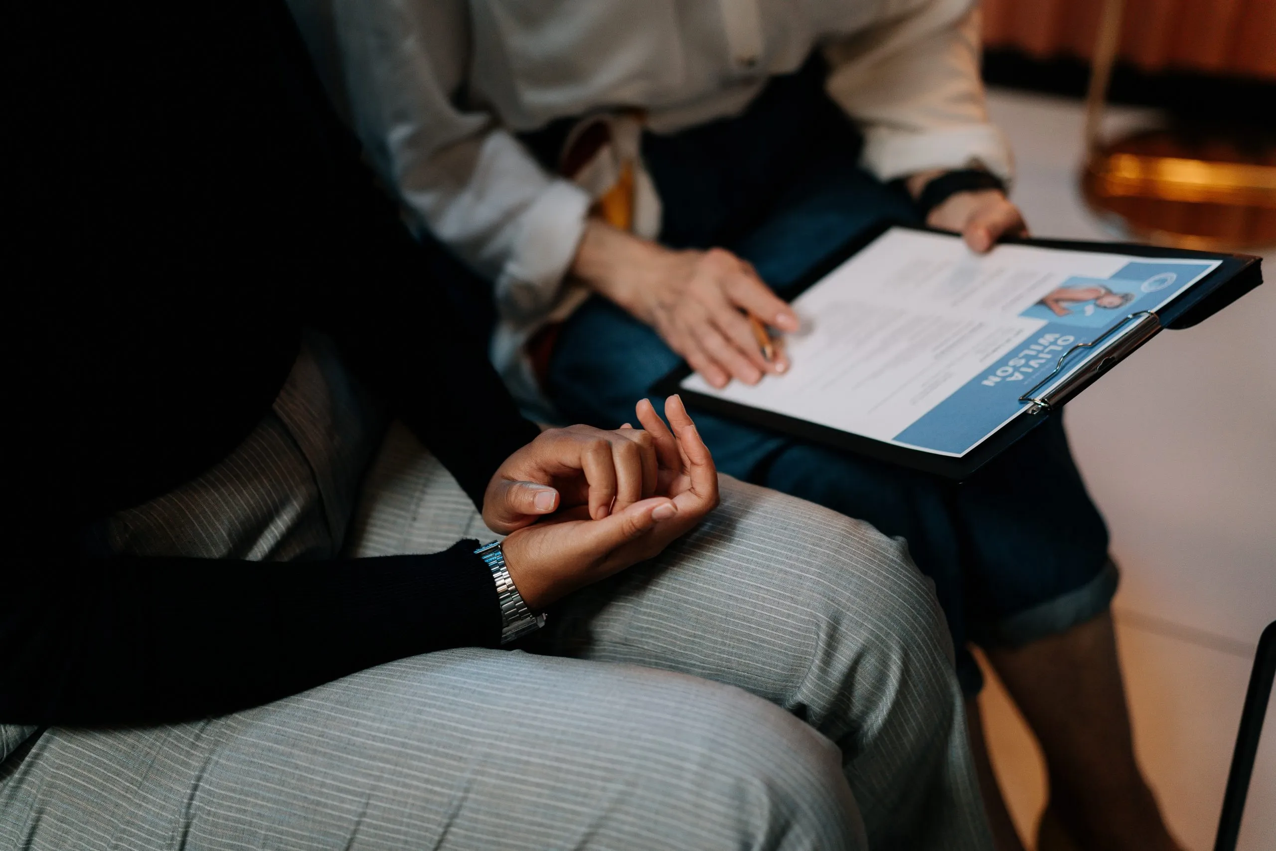 Two people looking over a resume