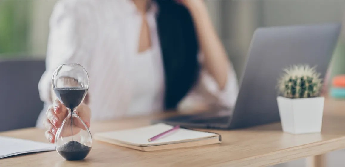Woman at her desk working on her laptop
