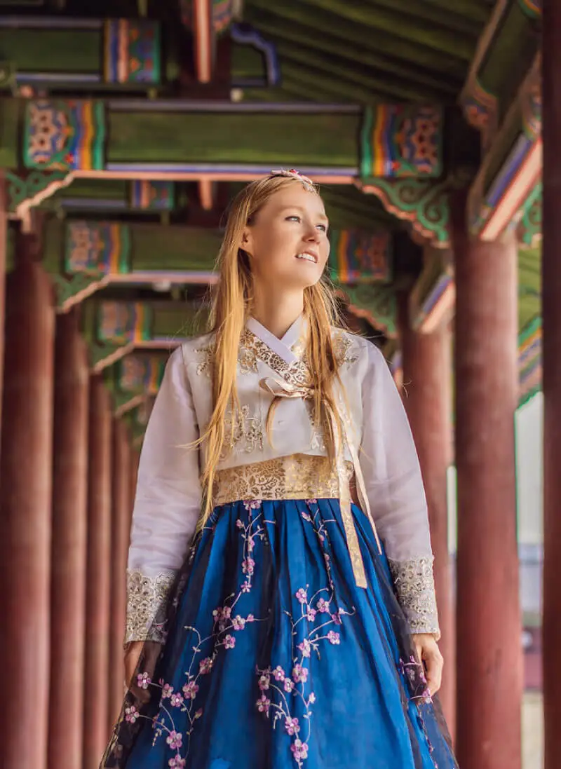 Blonde woman in native Asian dress