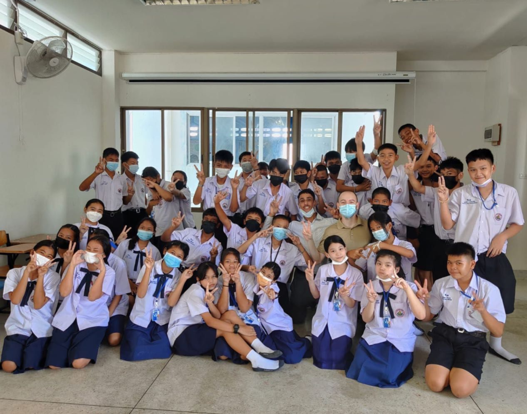 TEFL teacher in Thailand posing with students