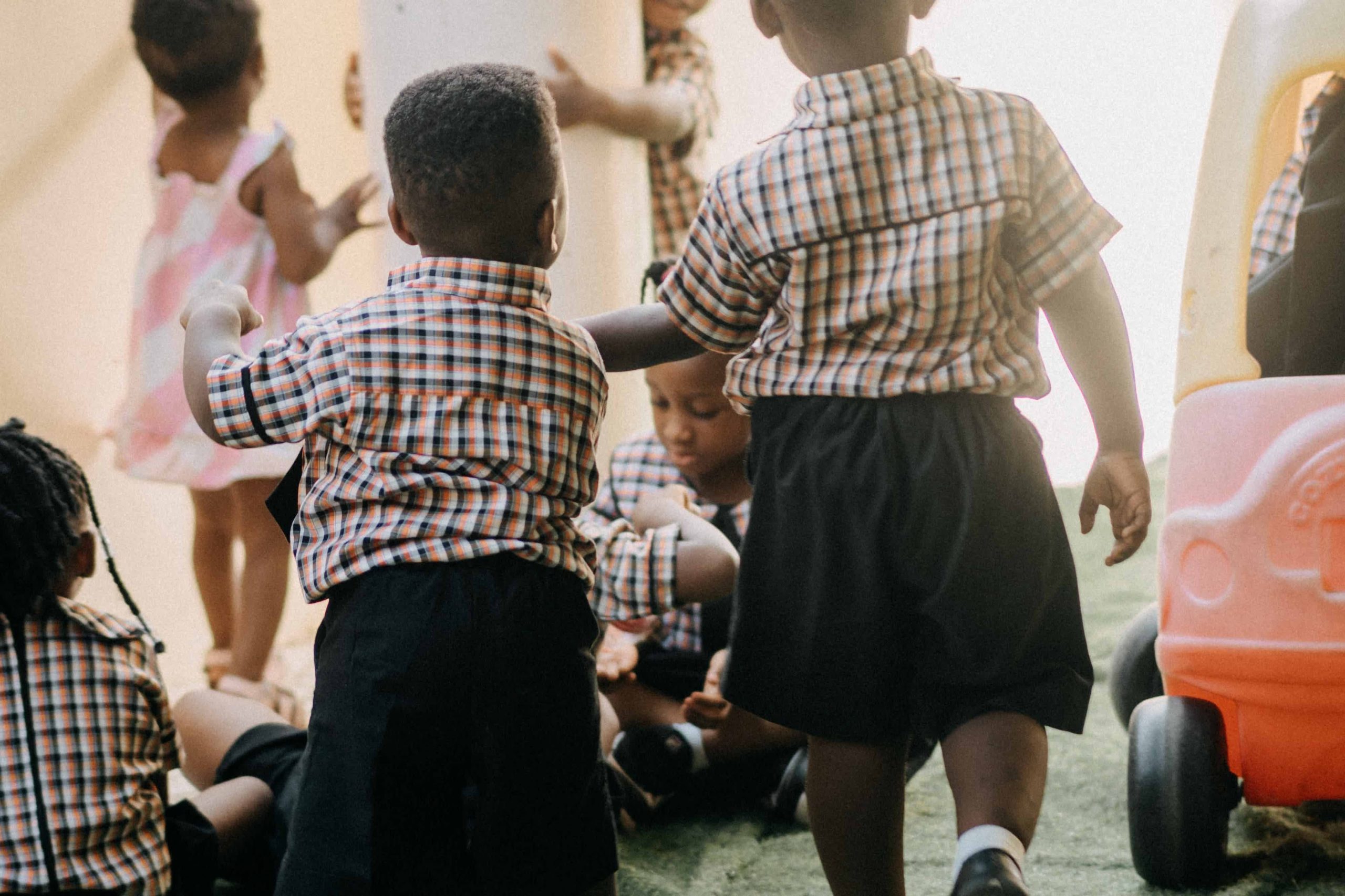 Young children moving and playing together, illustrating a total physical response activity for early years learners