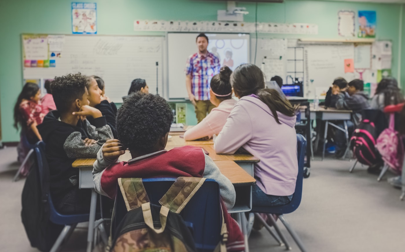 English teacher leading a class, typical of language academy teaching jobs in Italy