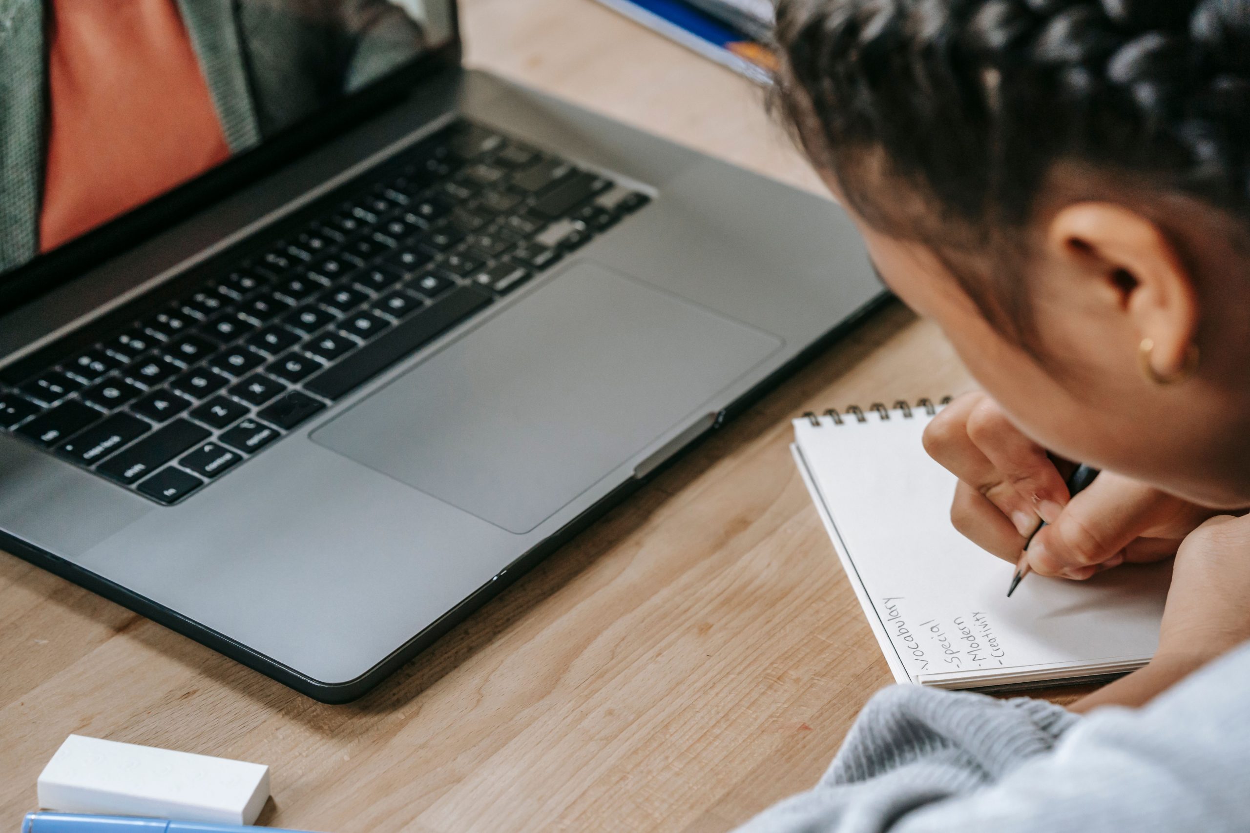 Student studying an online TEFL course on a laptop, the lower-cost route to TEFL certification