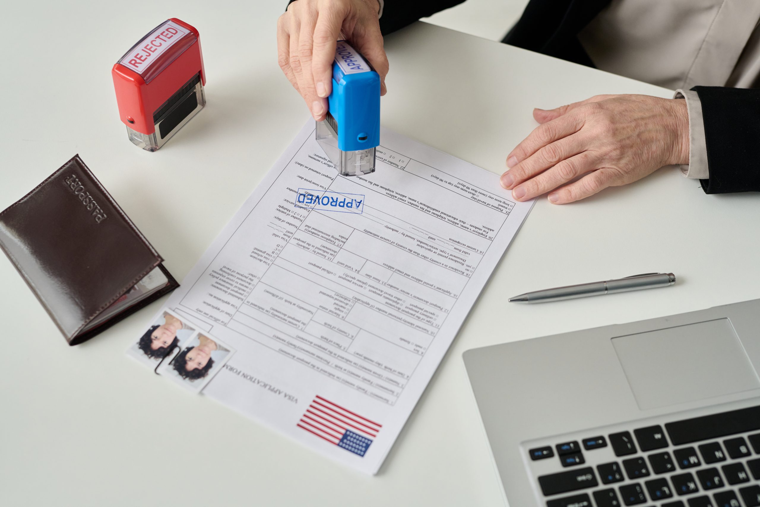 Teach English in Korea without a degree: visa application form being stamped at an immigration desk