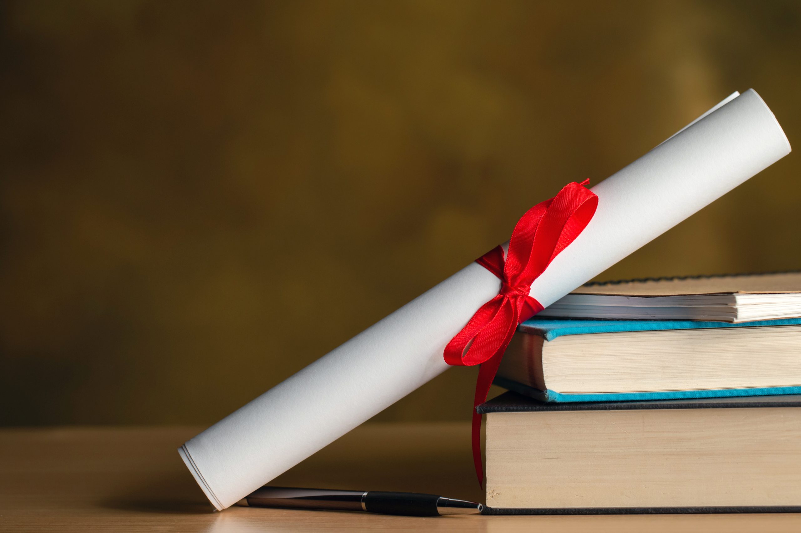 CPD certificates and a regulated TEFL qualification on a desk with course books