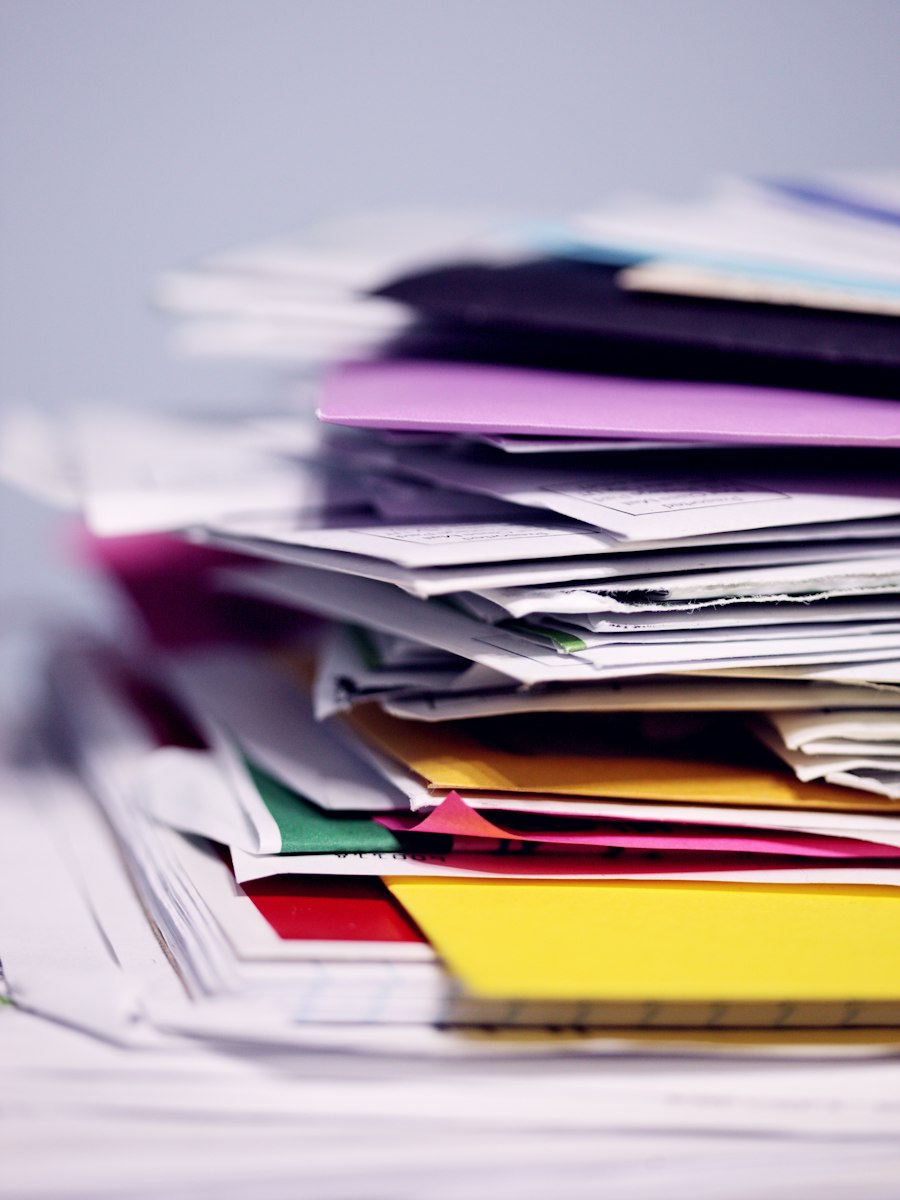 A pile of printed documents of the kind gathered for a criminal record check and visa file