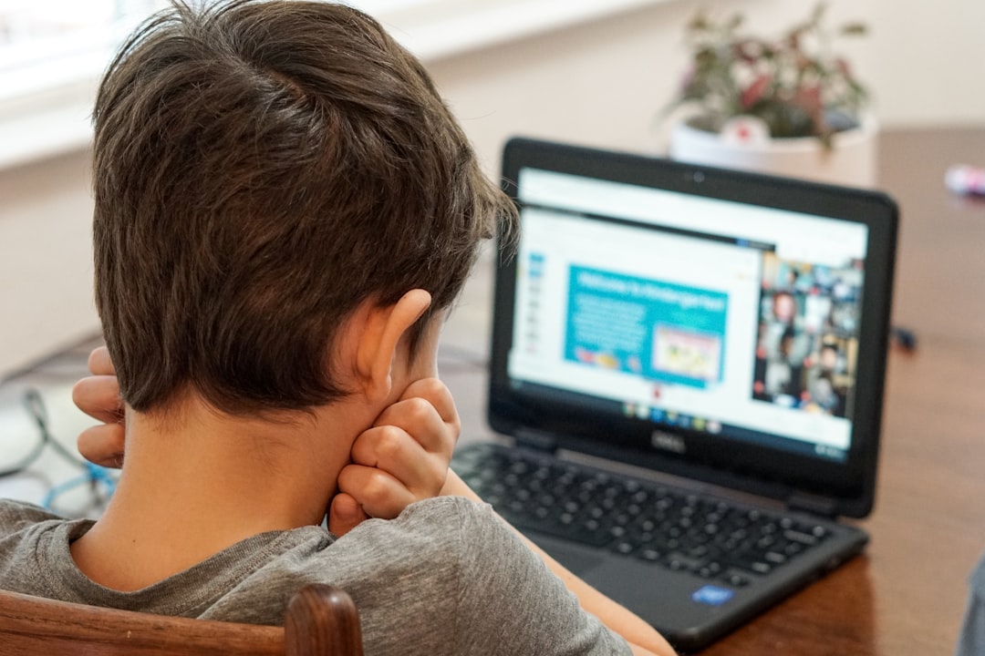 Young child at a laptop in an online English class, the age group Novakid teachers work with