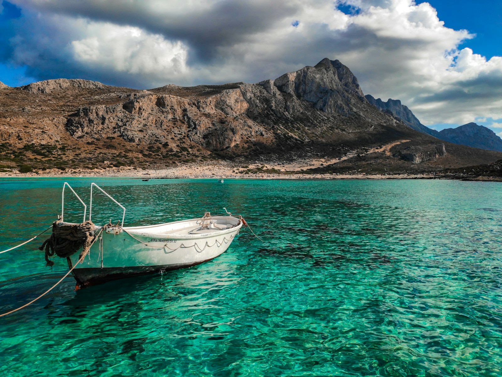 Small boat moored at Balos on the Crete coast, near where summer camps run watersports sessions