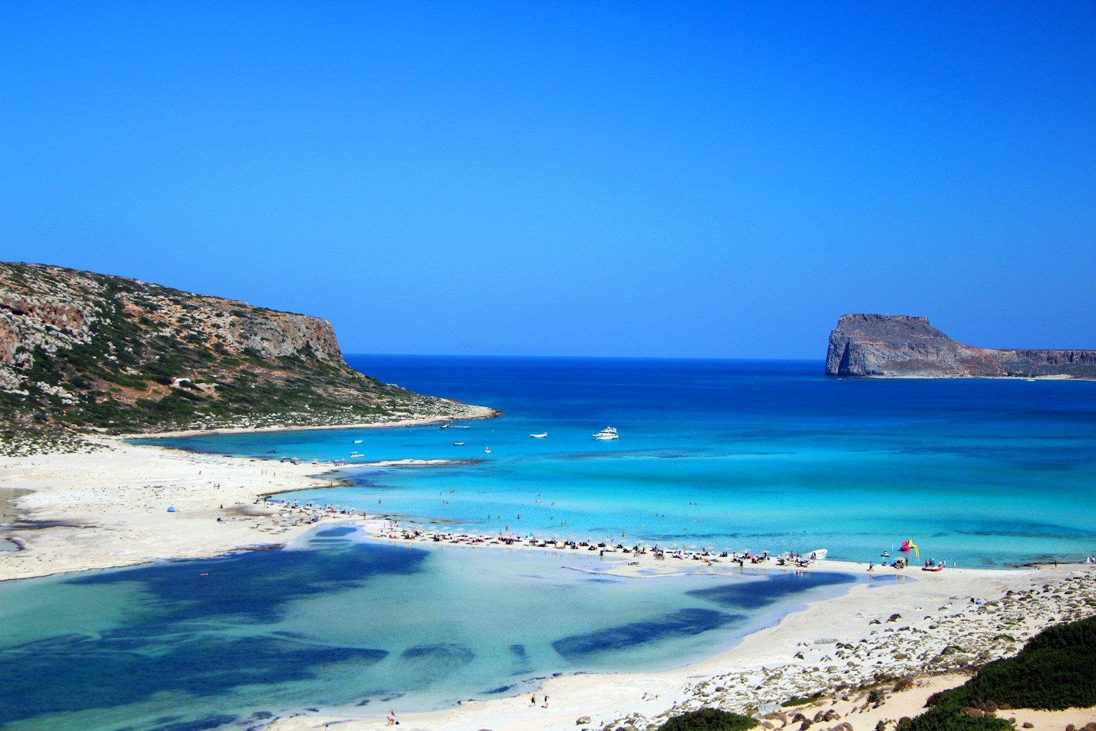 Rocky beach and clear sea in Crete, where island summer English camps run from June to August