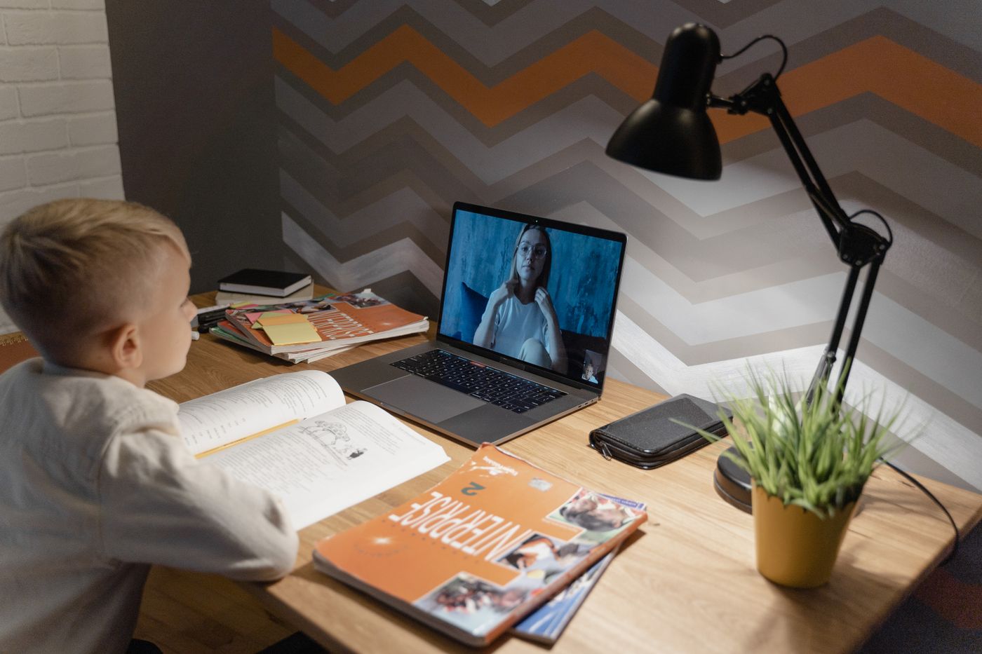 Cambly tutor teaching a one to one online English lesson from home on a laptop