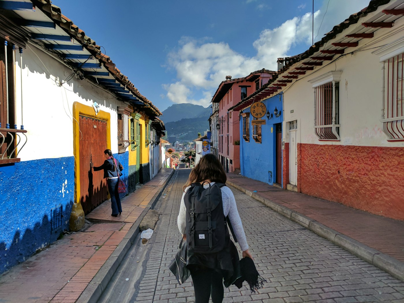Residential street of colourful houses in Colombia, where a teacher's rent depends heavily on the neighbourhood estrato