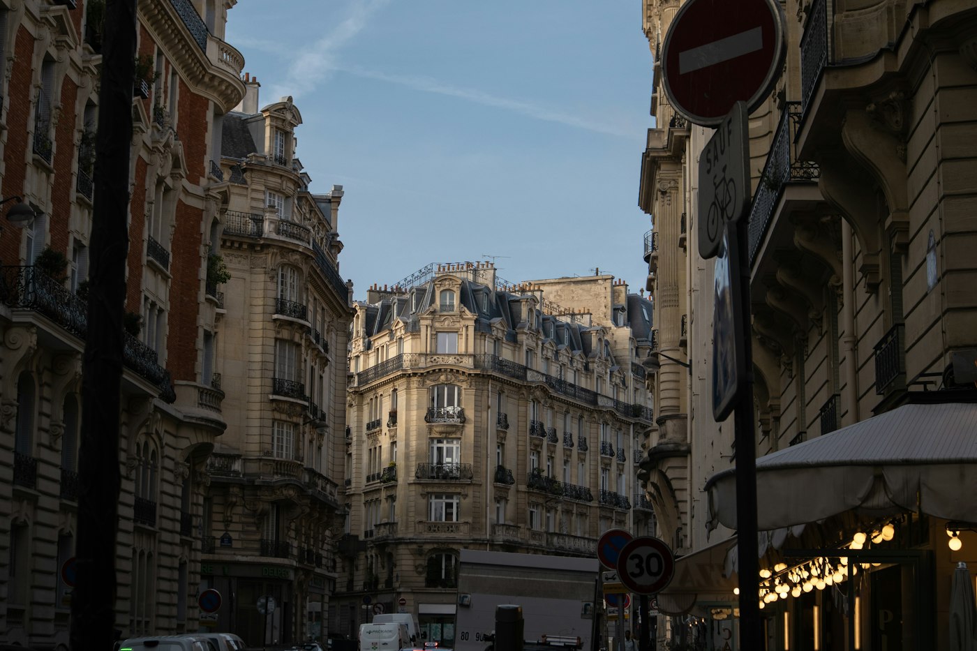 Street of tall apartment buildings in Paris, the most expensive city in France for English teachers to rent in