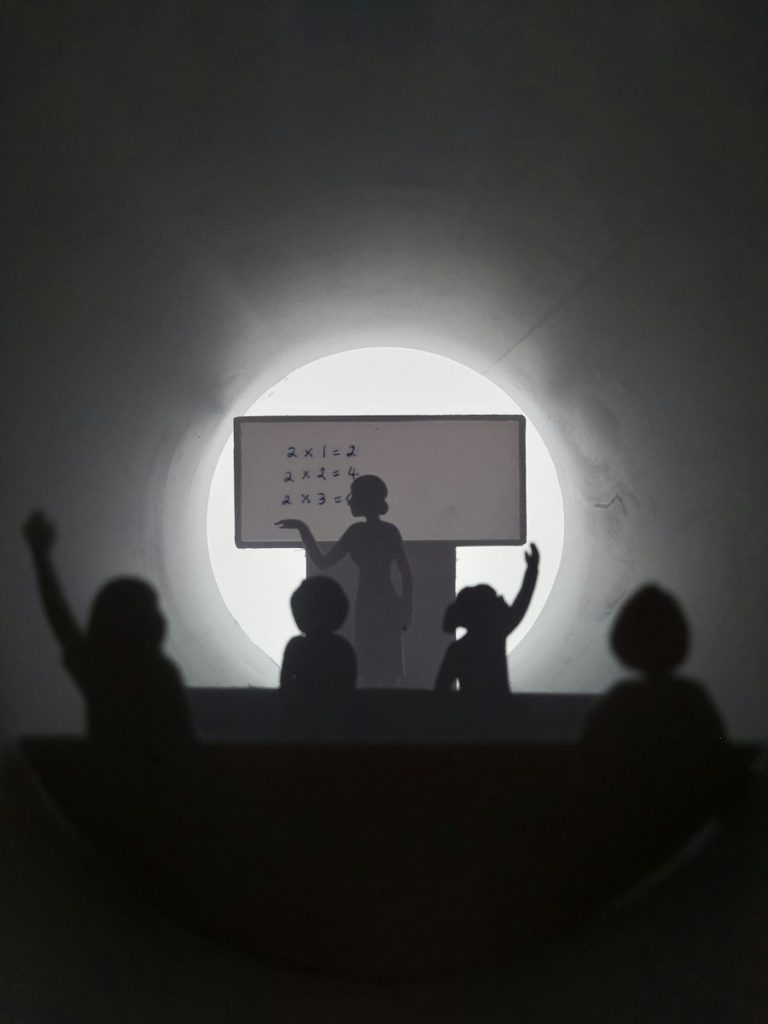 A teacher modelling a reading strategy for English learners during an instructional coaching cycle