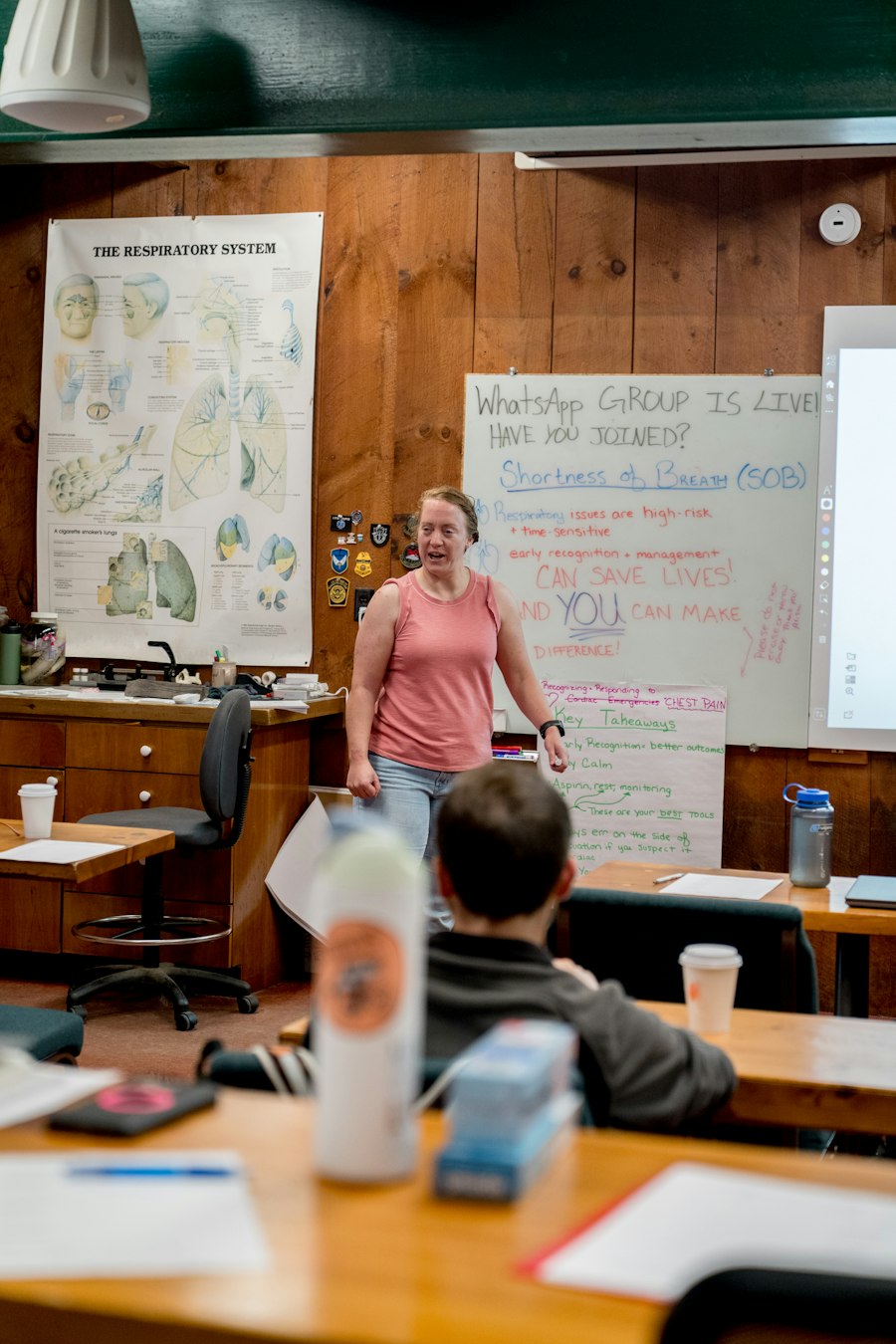 Teacher leading a class discussion, illustrating praxis as theory put into classroom practice