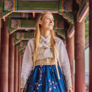 Blonde woman in native Asian dress
